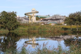 A pond with a building in the background