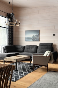 A living room filled with furniture and a large window