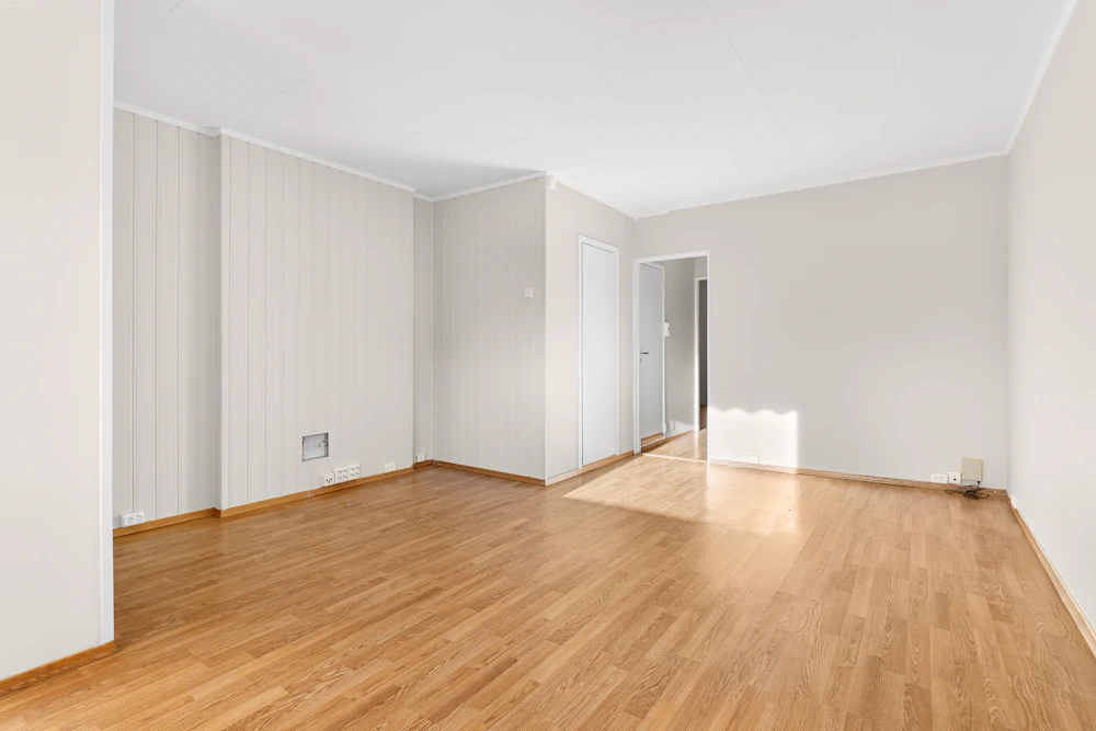 Empty modern room with herringbone wood flooring