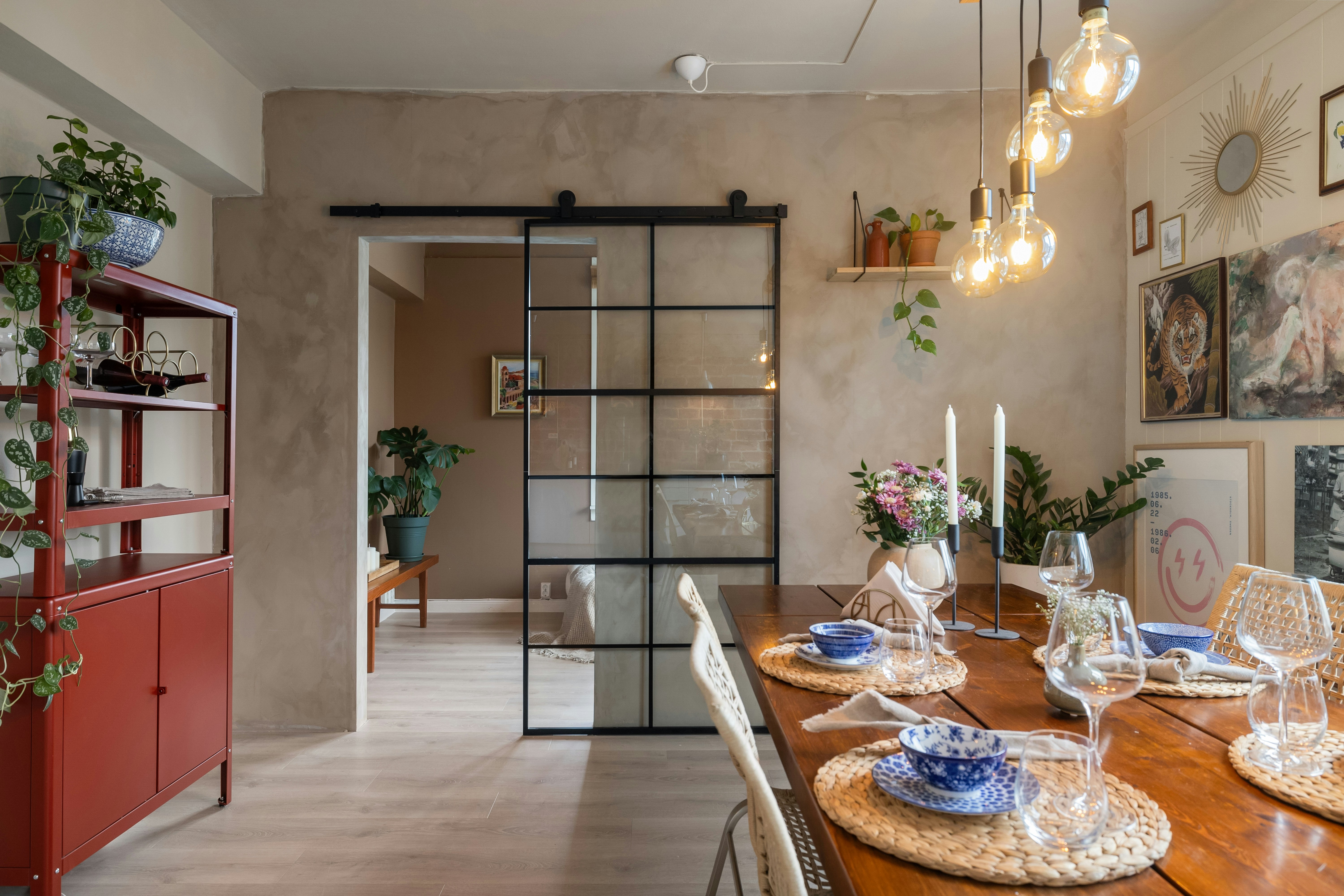 A dining room with a wooden table and chairs