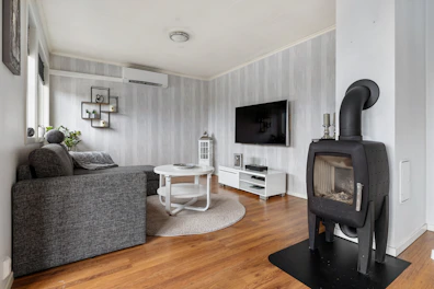 A living room filled with furniture and a flat screen TV