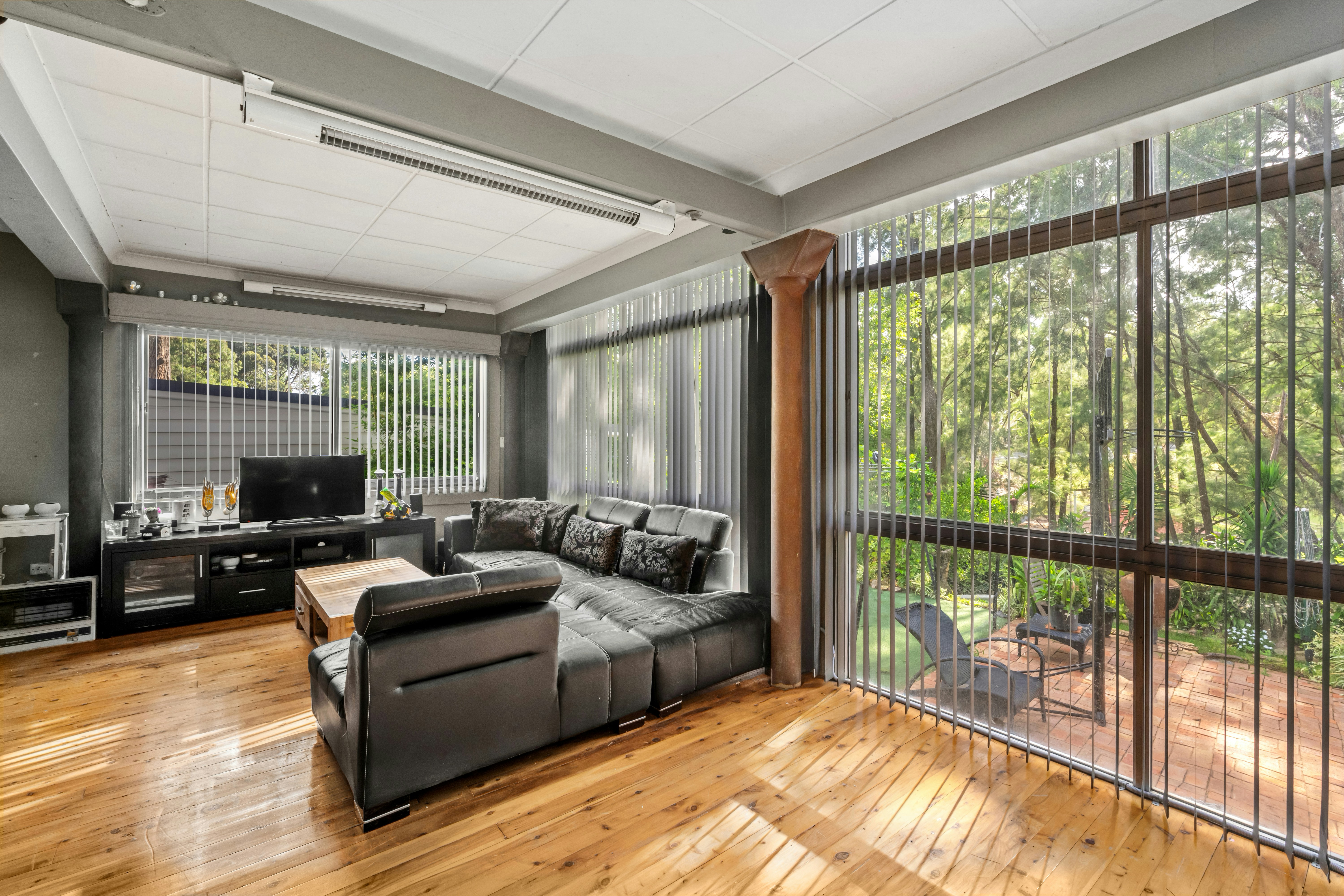 Spacious 3 BHK living room with floor-to-ceiling windows overlooking Dwarka Expressway