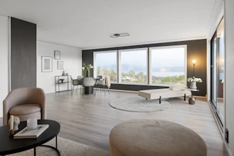 A living room filled with furniture and a large window