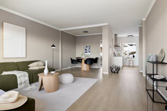 A living room filled with furniture and a wooden floor