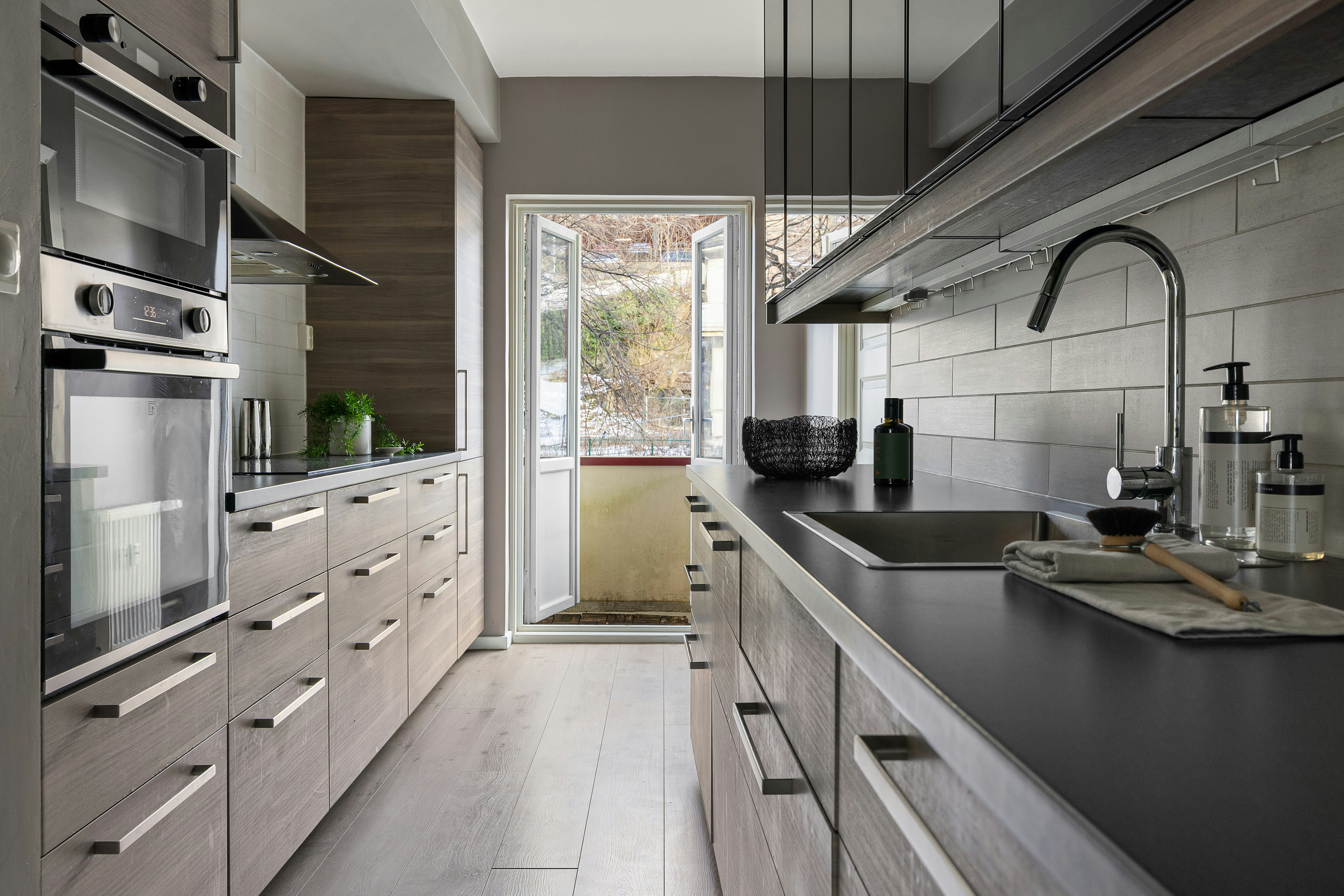 A close-up shot of a set of house keys resting on a professional architectural blueprint, signifying a successful real estate transaction and homeownership.