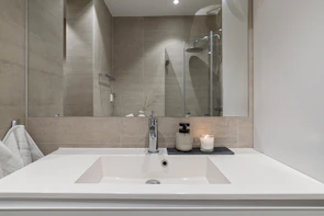 A bathroom with a sink and a mirror