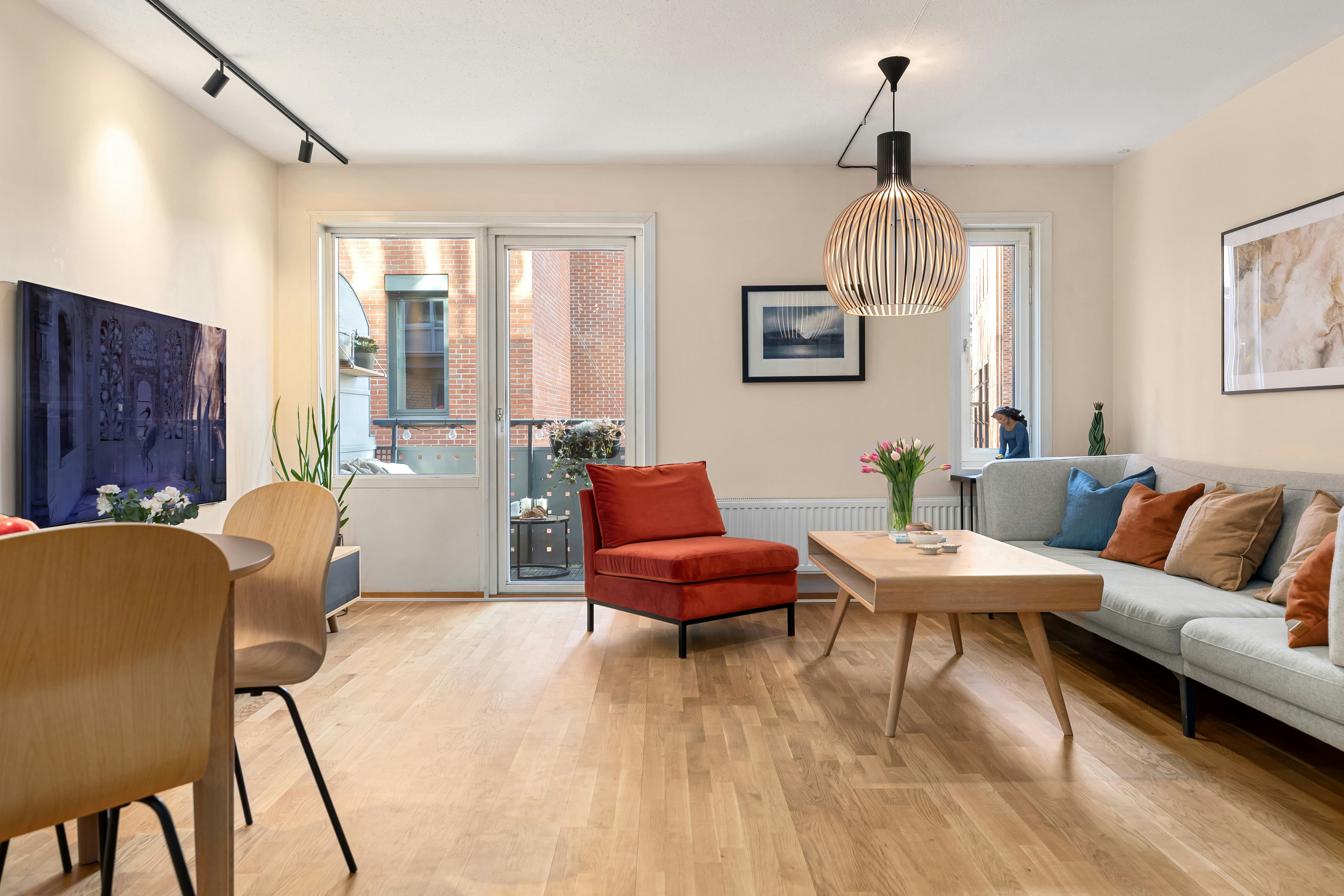 A living room filled with furniture and a flat screen TV