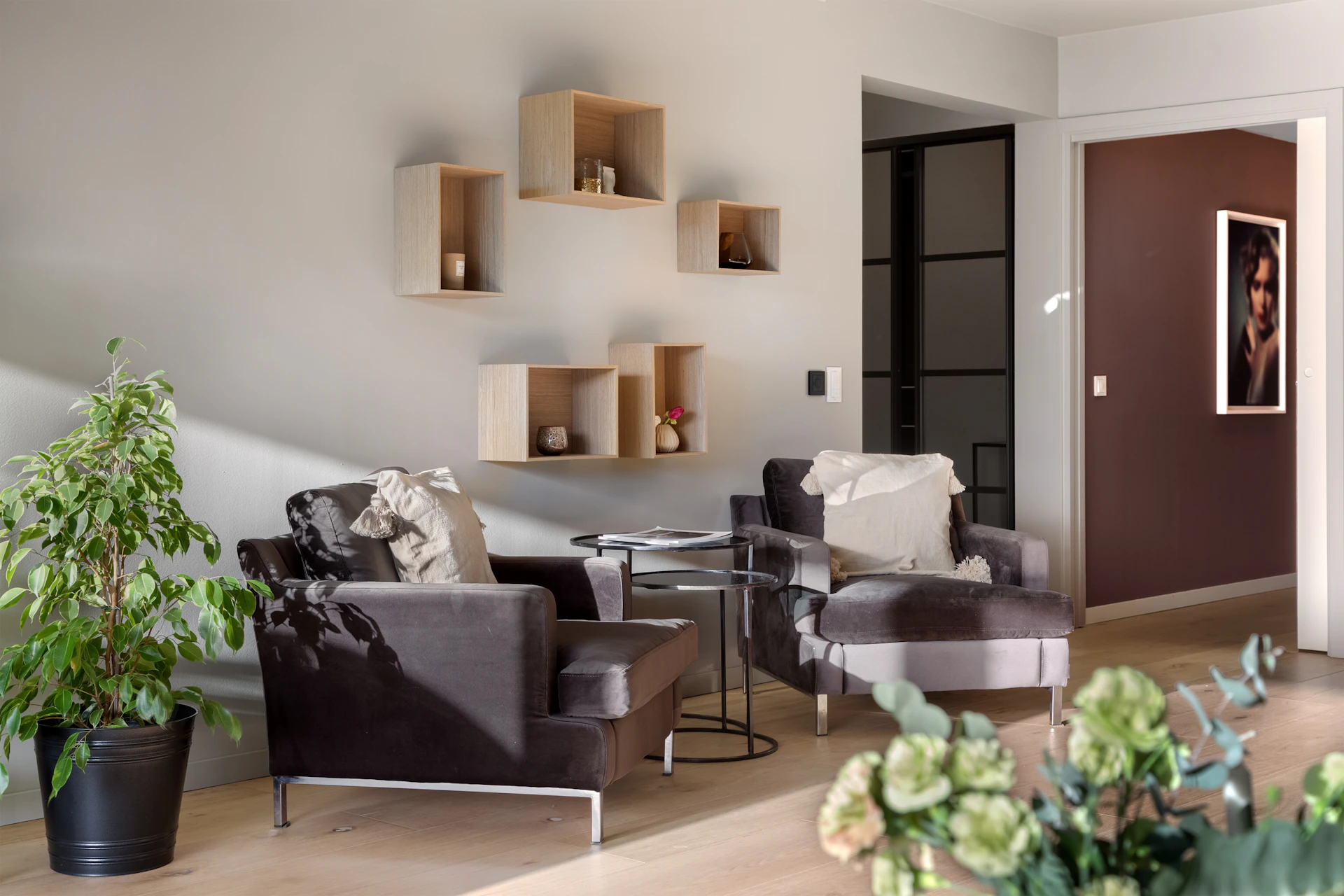 A living room filled with furniture and a wooden floor