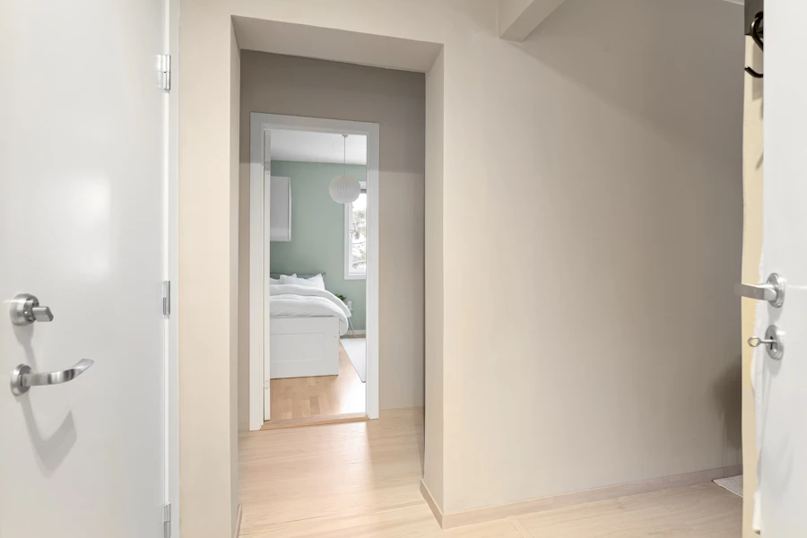 An open interior door leading into a bedroom
