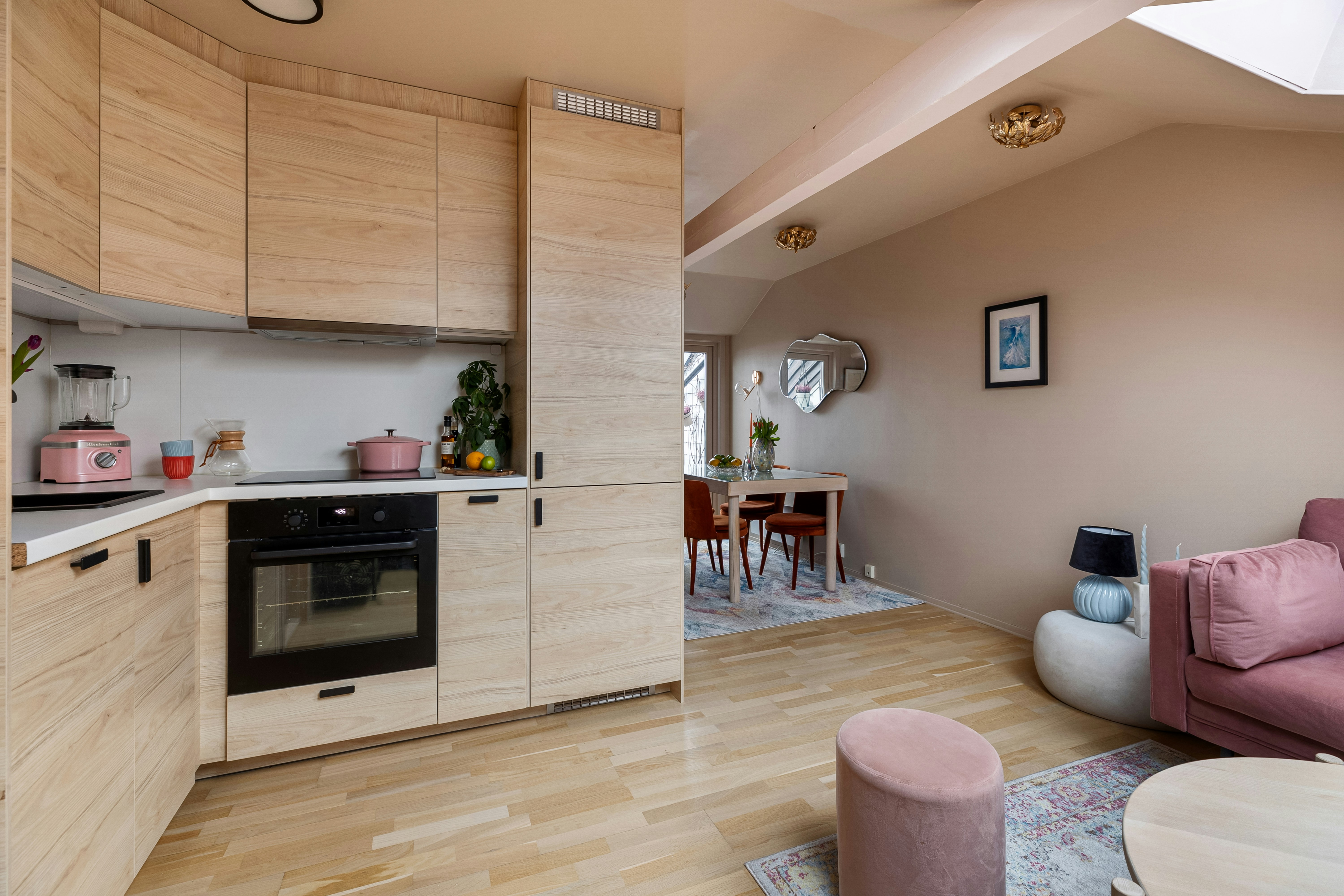A living room filled with furniture and a kitchen