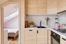 A kitchen with a sink and a stove top oven