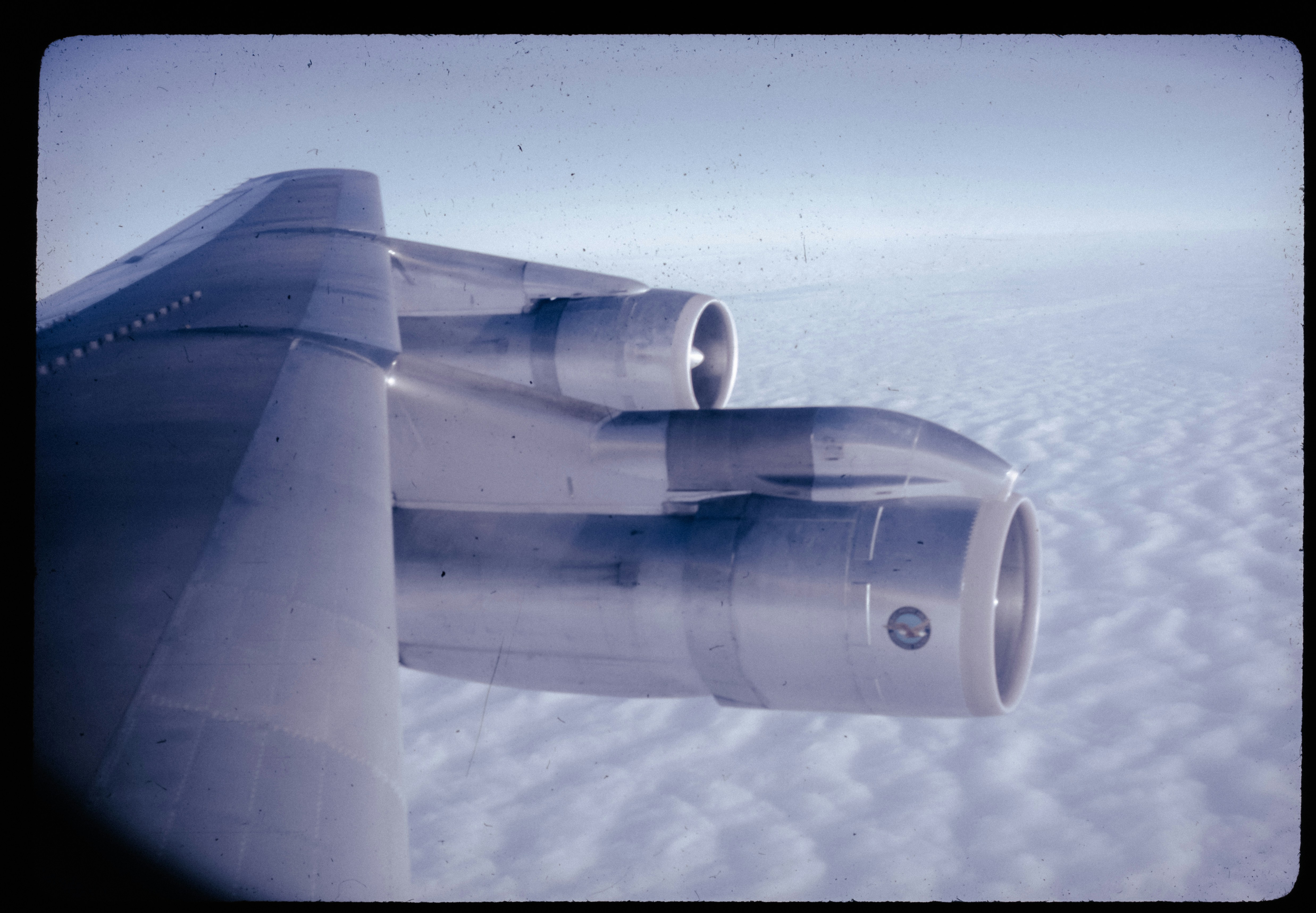 A view of the wing of an airplane in the sky, 