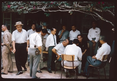 A group of men standing around each other