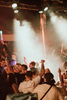 A group of people standing in front of a crowd