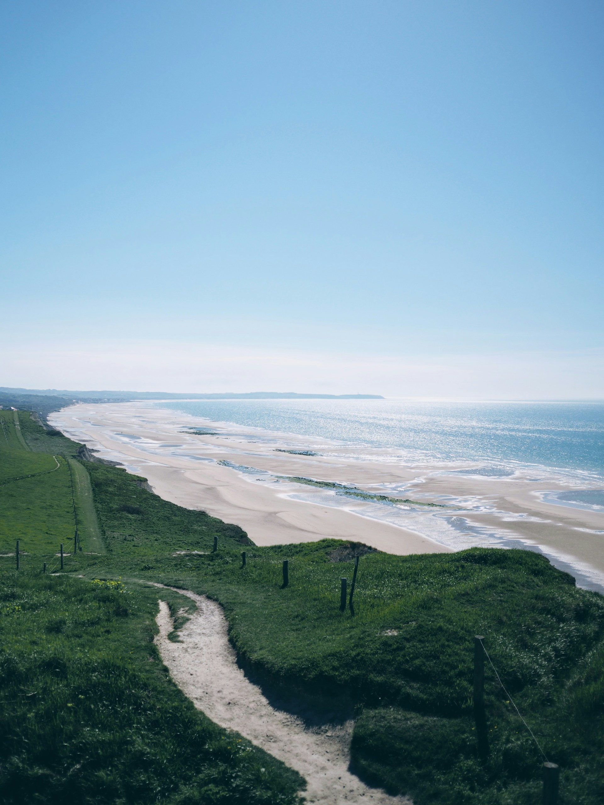 A view of a beach from a hill