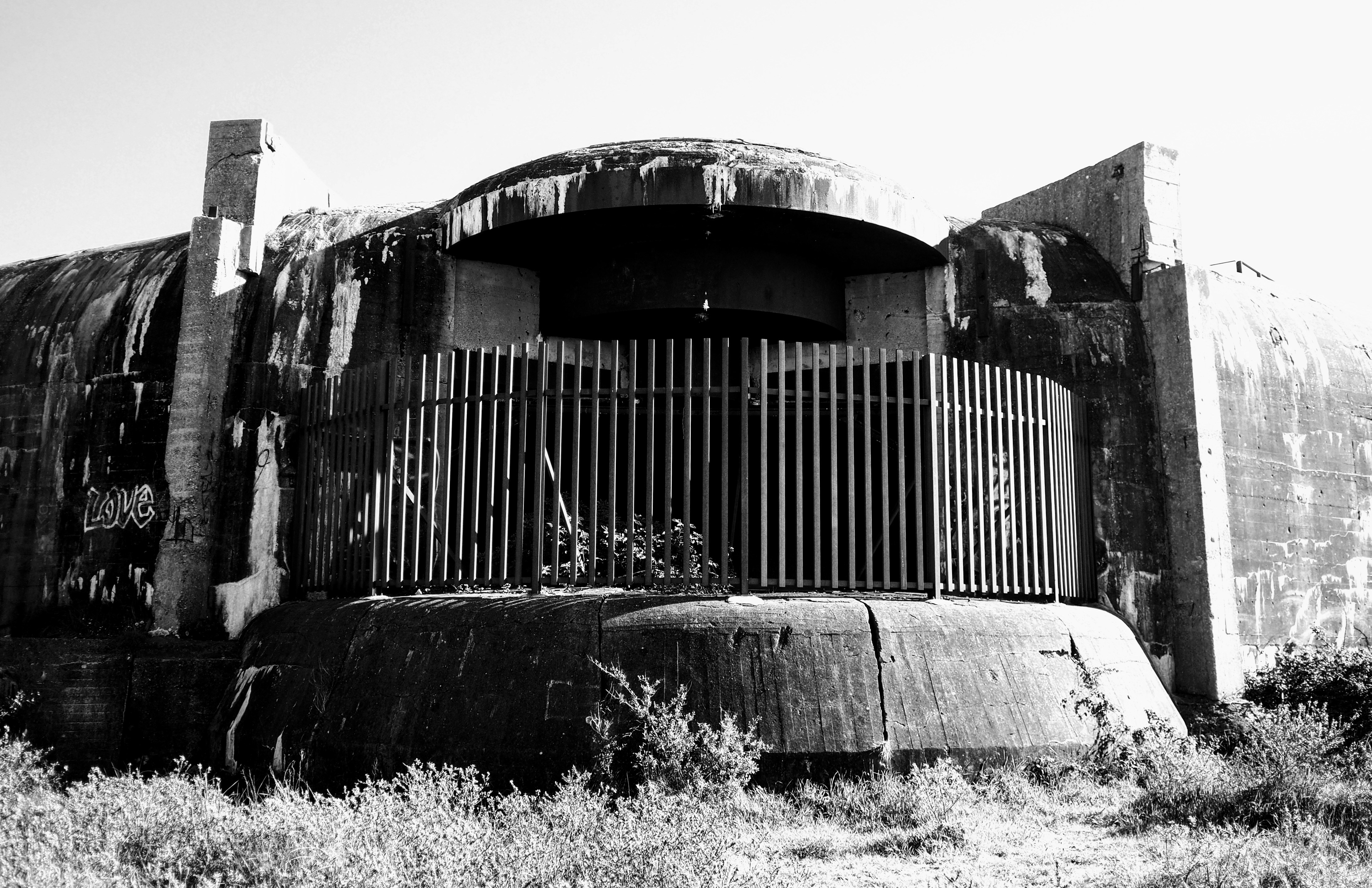 A black and white photo of an abandoned building, 