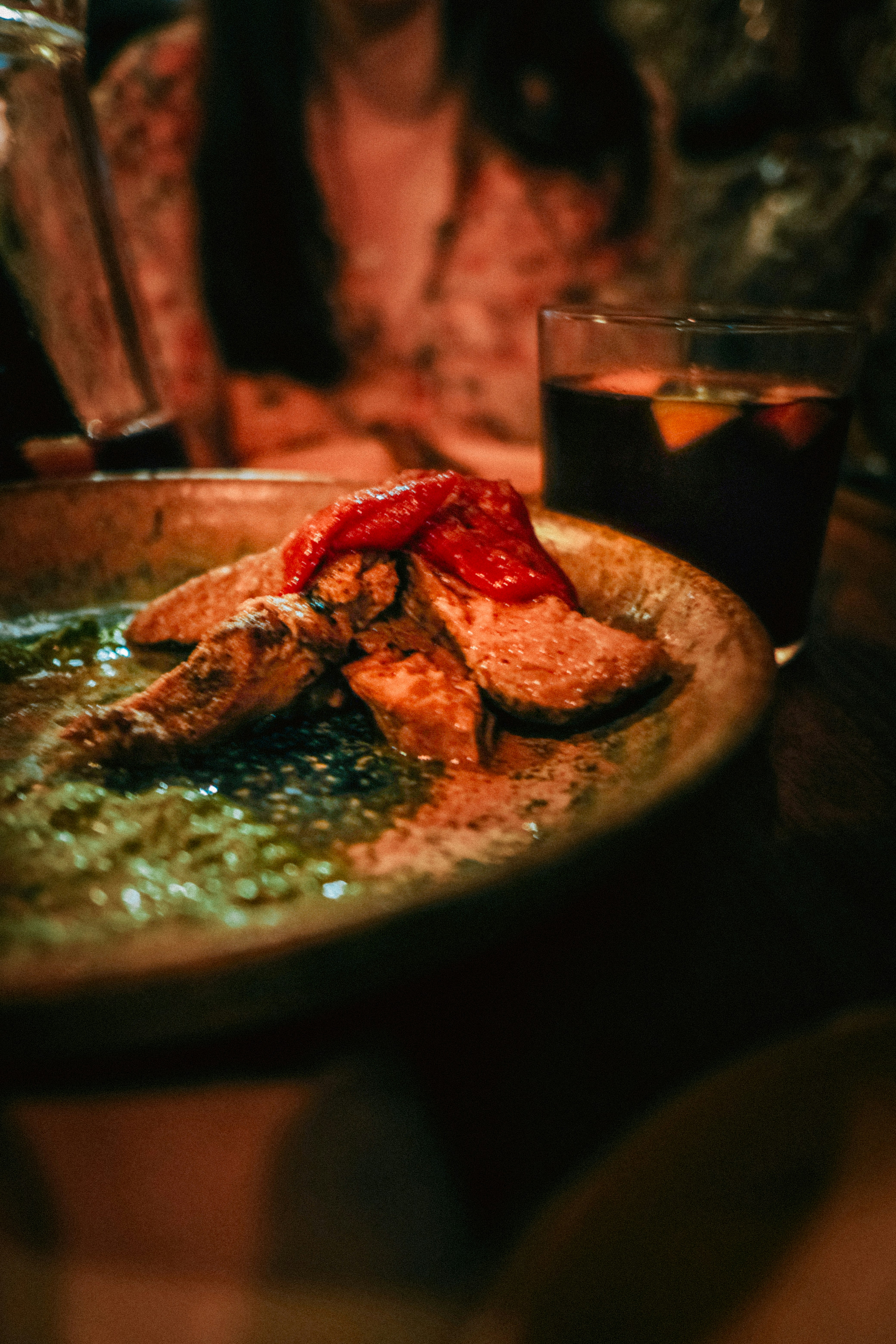A person sitting at a table with a plate of food