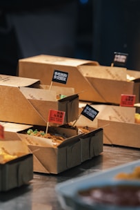 Several boxes of food sitting on a table