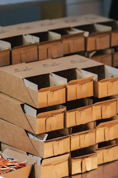 A stack of boxes sitting on top of a wooden table