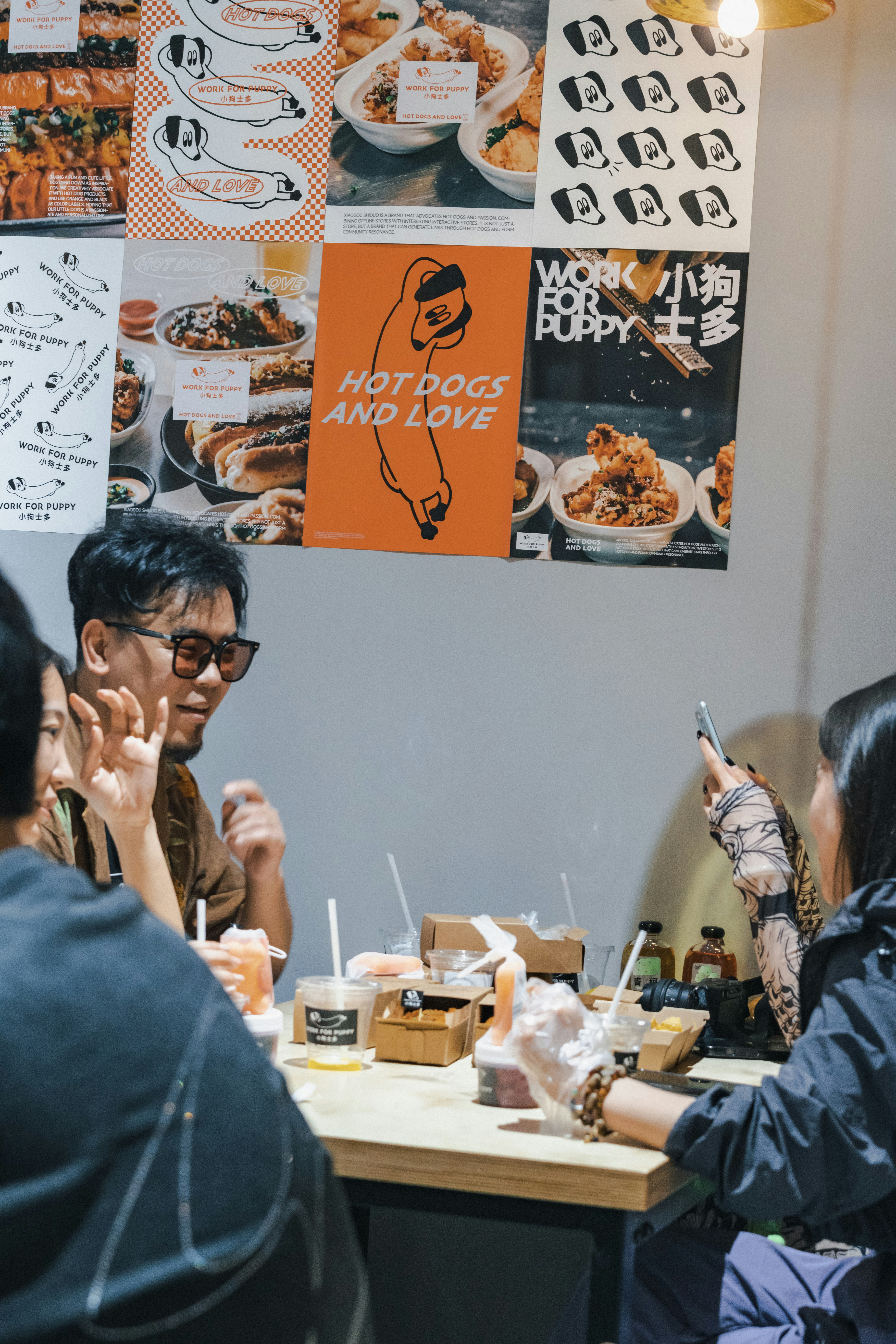 A group of people sitting around a table eating food