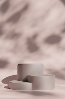 A group of three white bowls sitting on top of a table