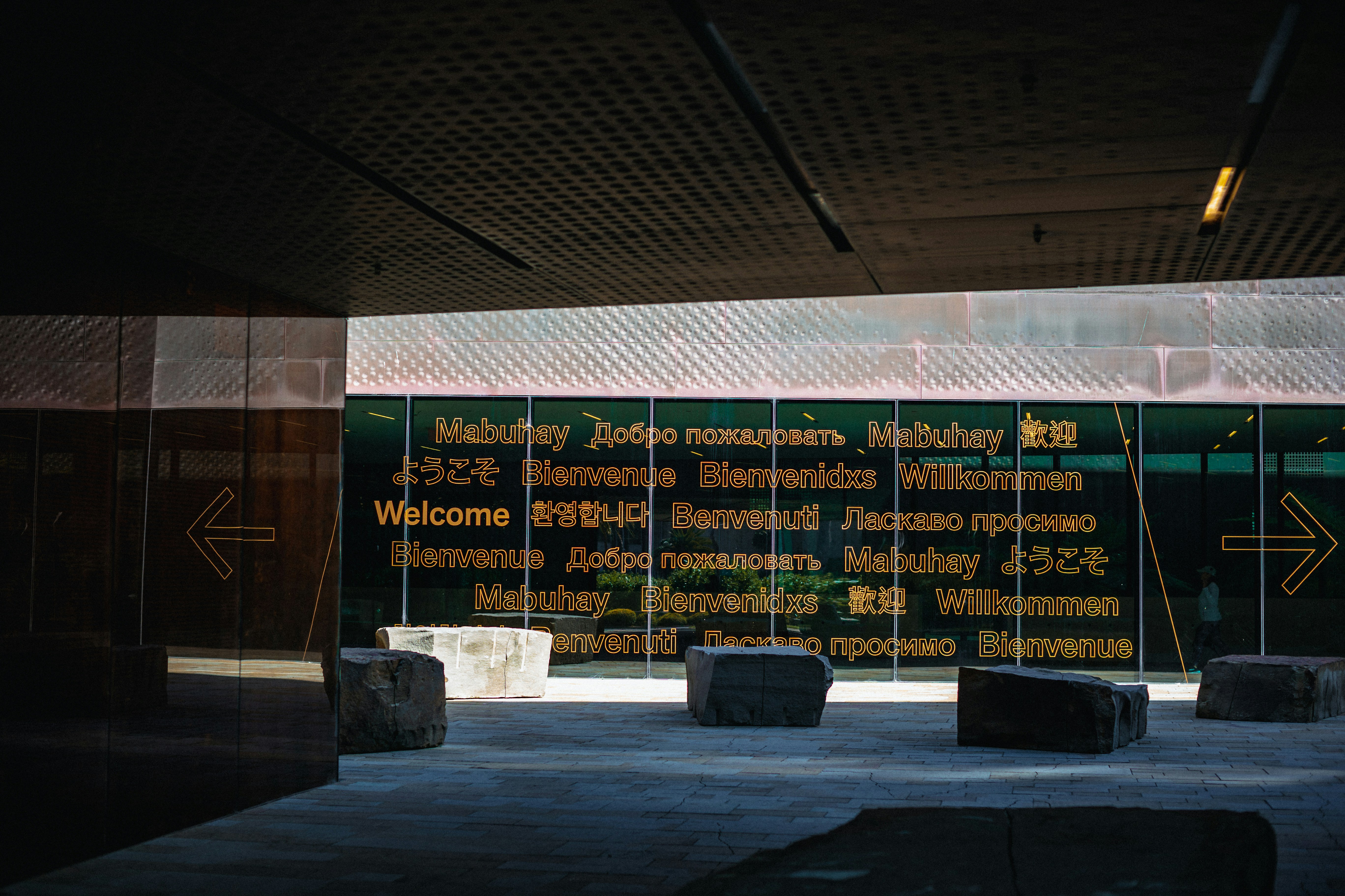 There is a sign in the middle of a building