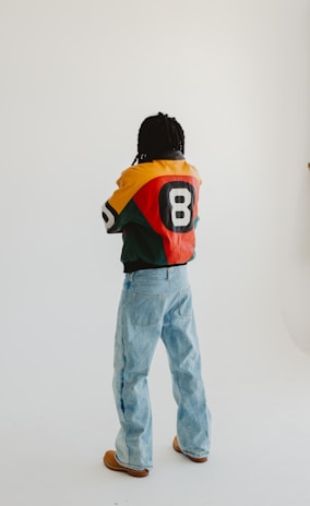 A man standing in front of a white wall
