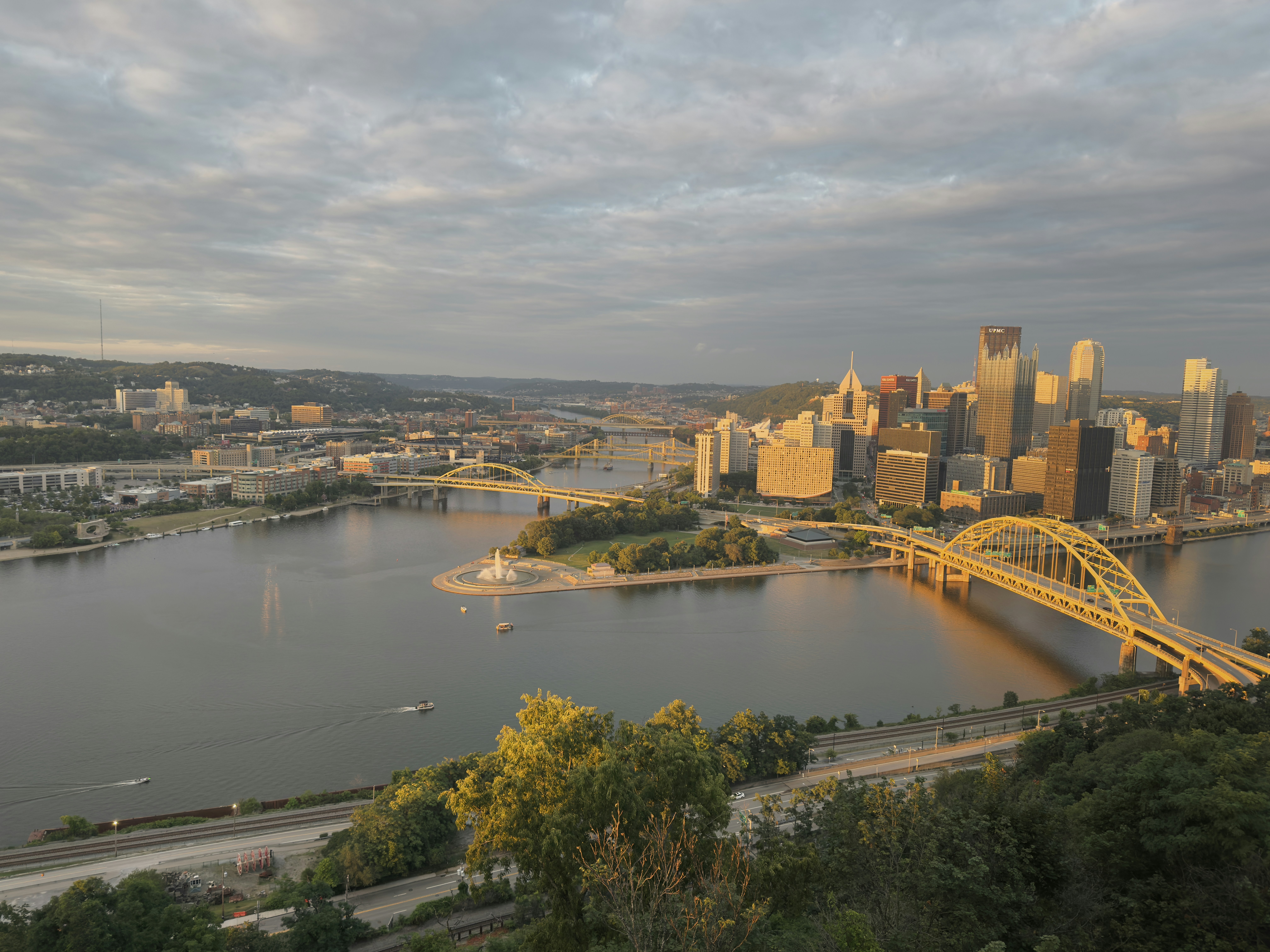 A view of a city and a bridge over a river