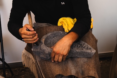 A woman sitting in a chair with a hat on her head