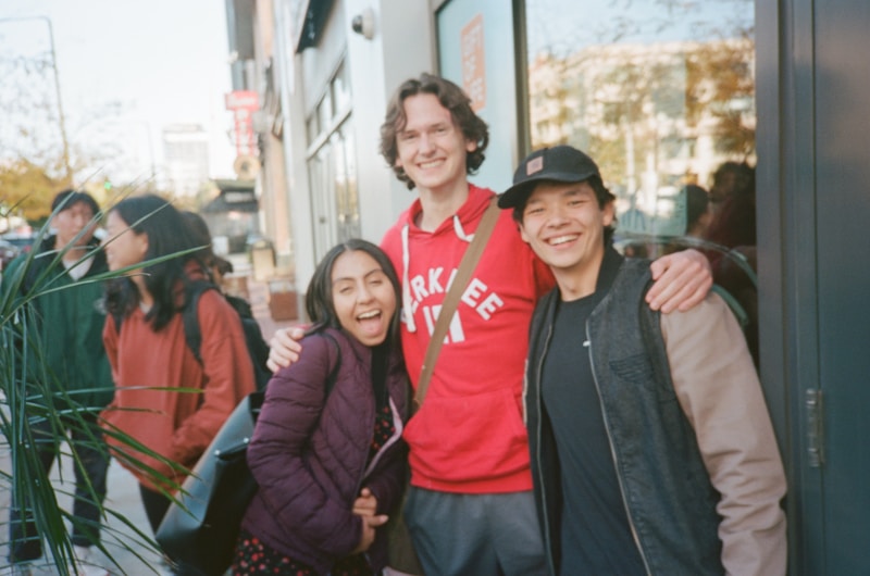 A group of people standing next to each other