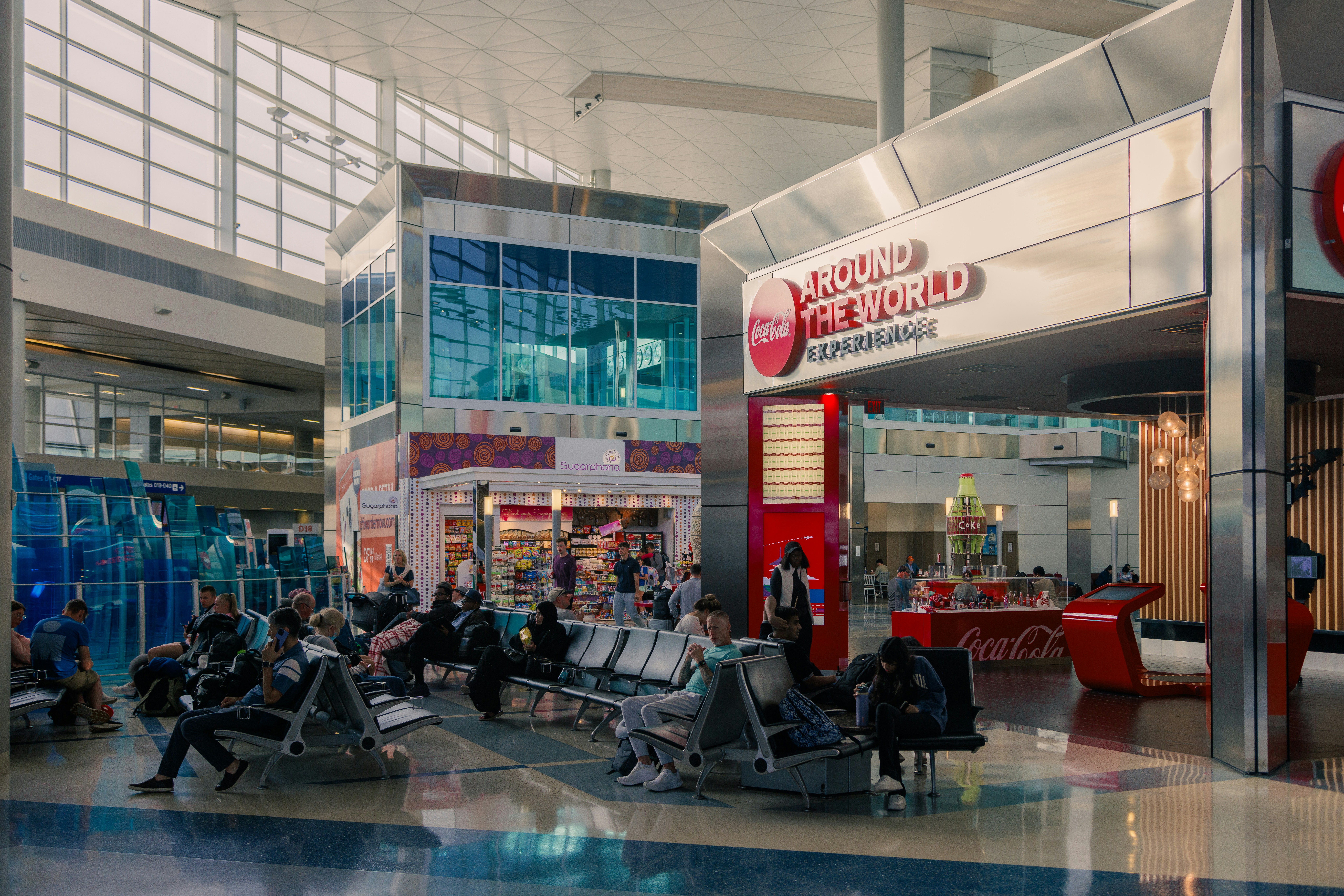 A group of people sitting at a table inside of a building