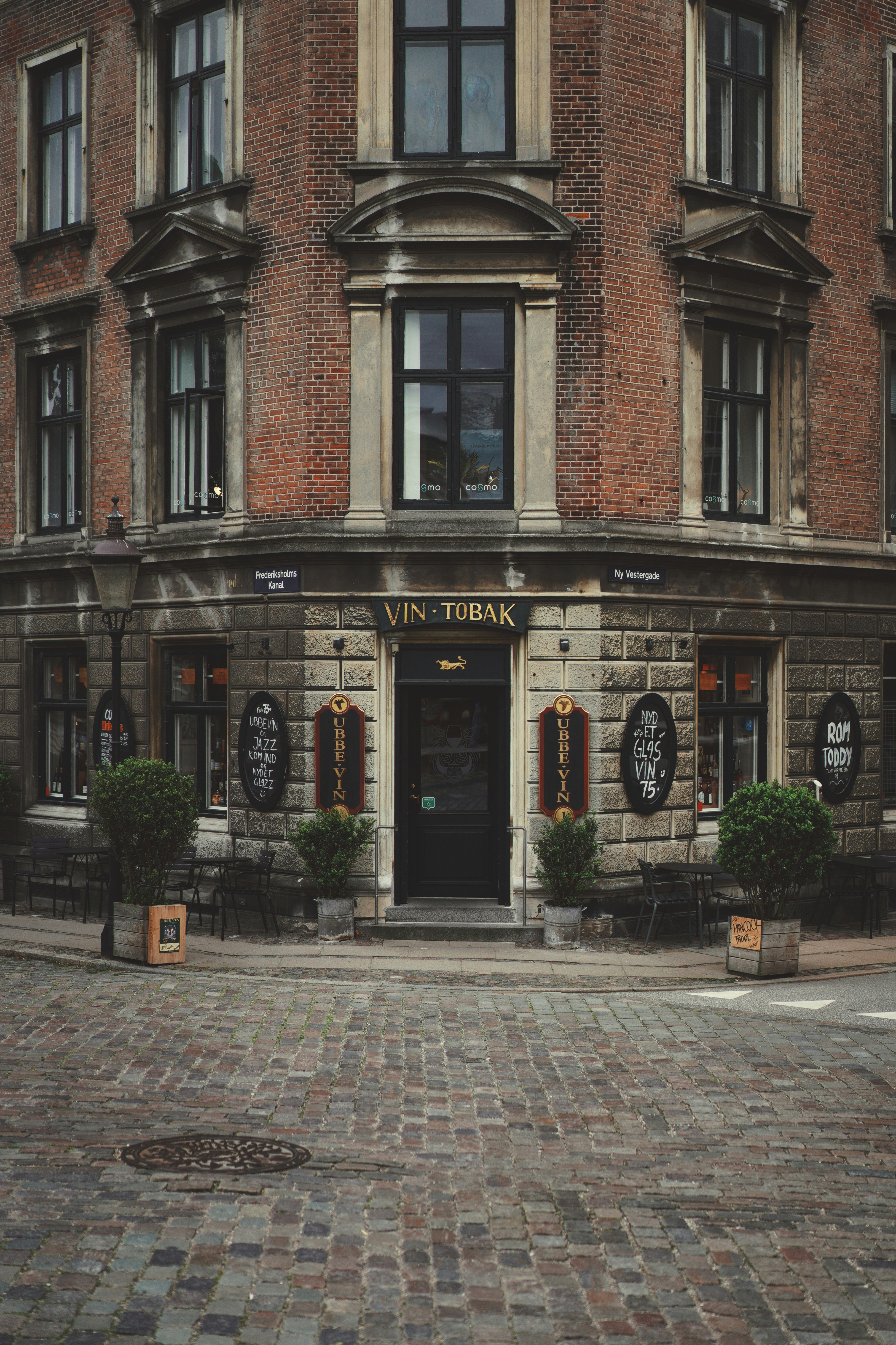 A brick building with a clock on the front of it