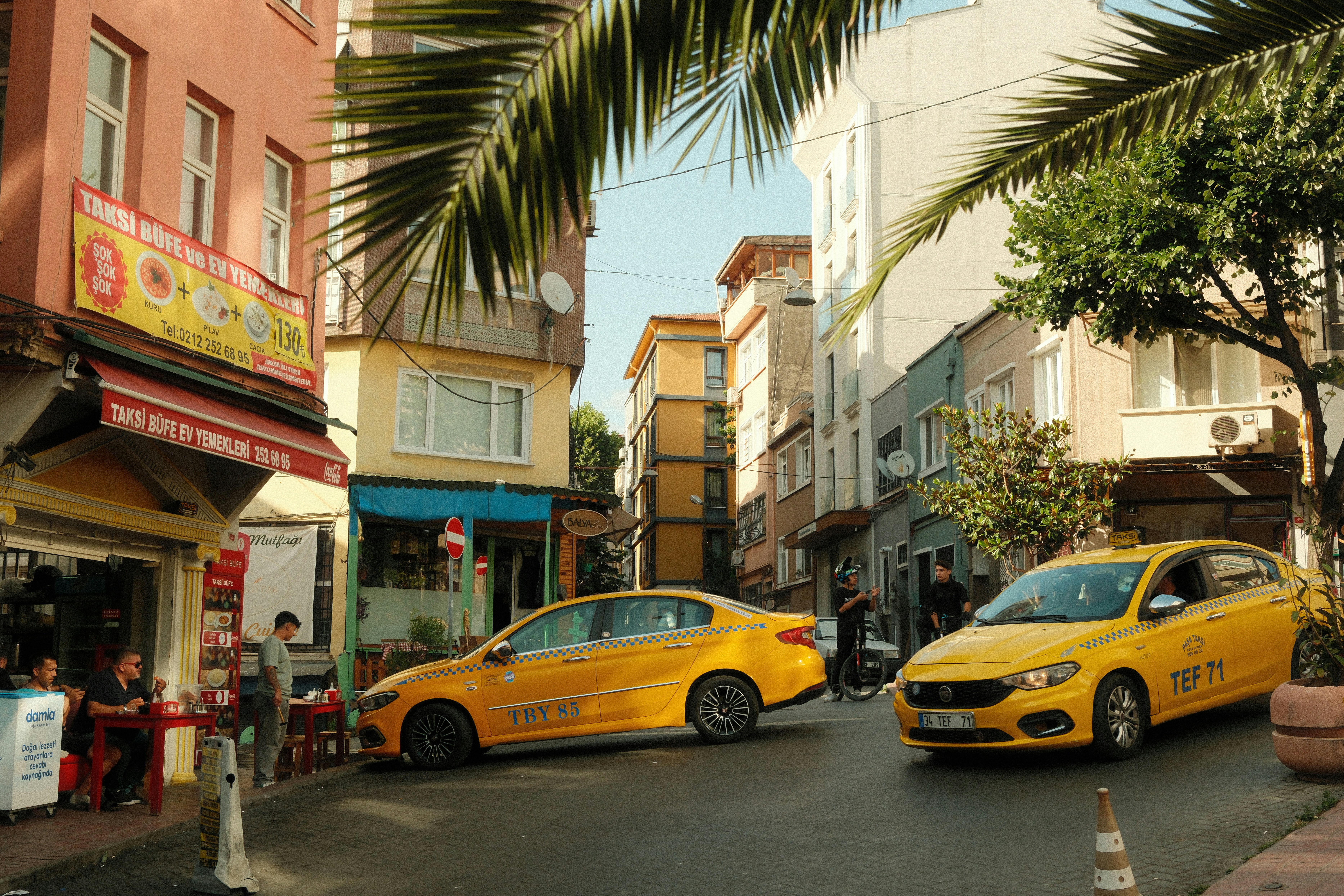 A couple of cars that are sitting in the street