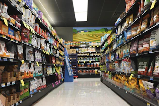 A grocery store aisle filled with lots of food