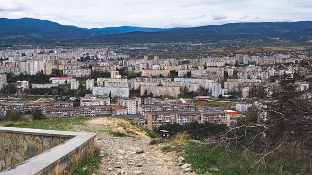 A view of a city from the top of a hill
