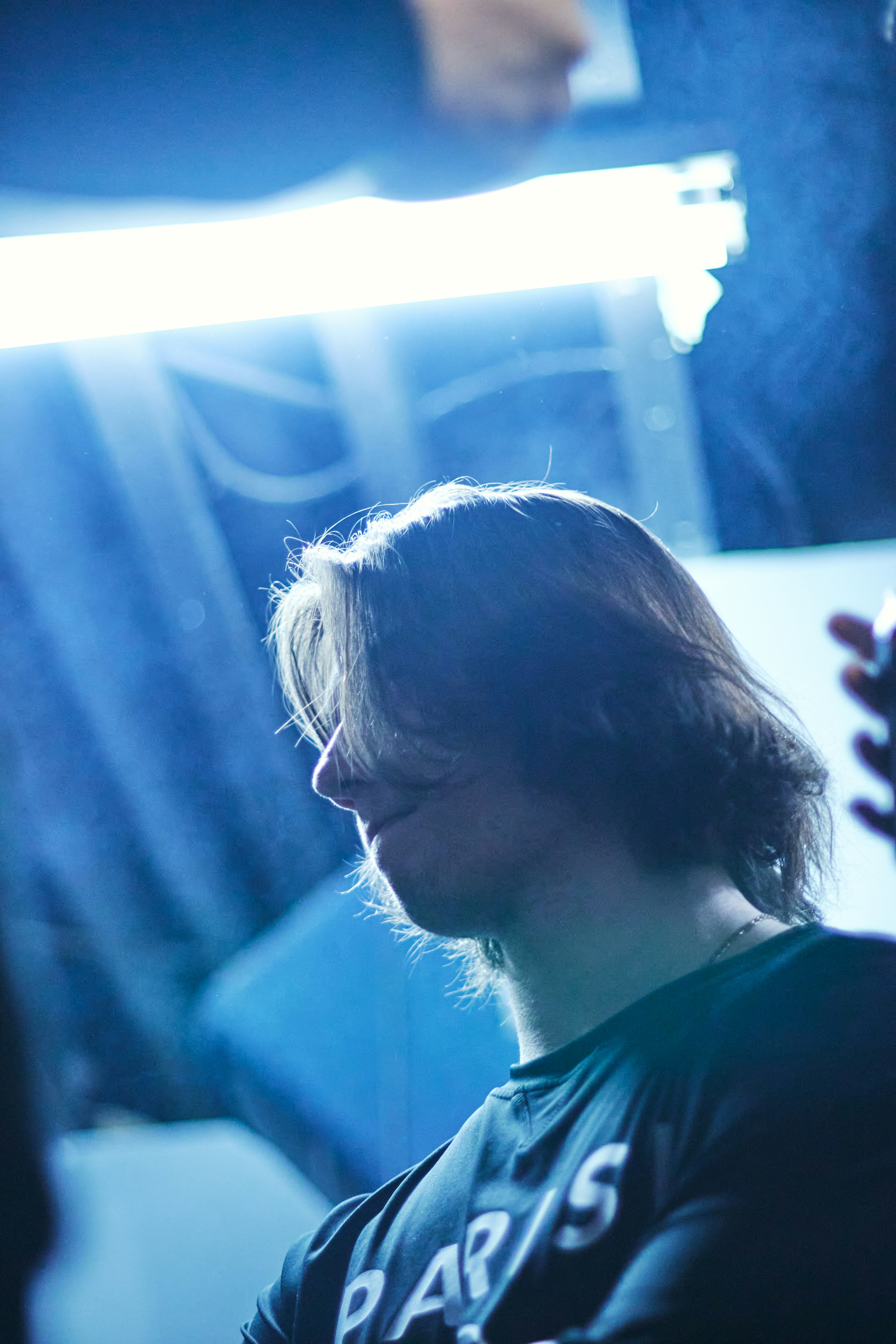 A man sitting in front of a mirror in a room