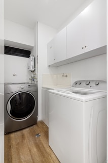 A laundry room with a washer and dryer