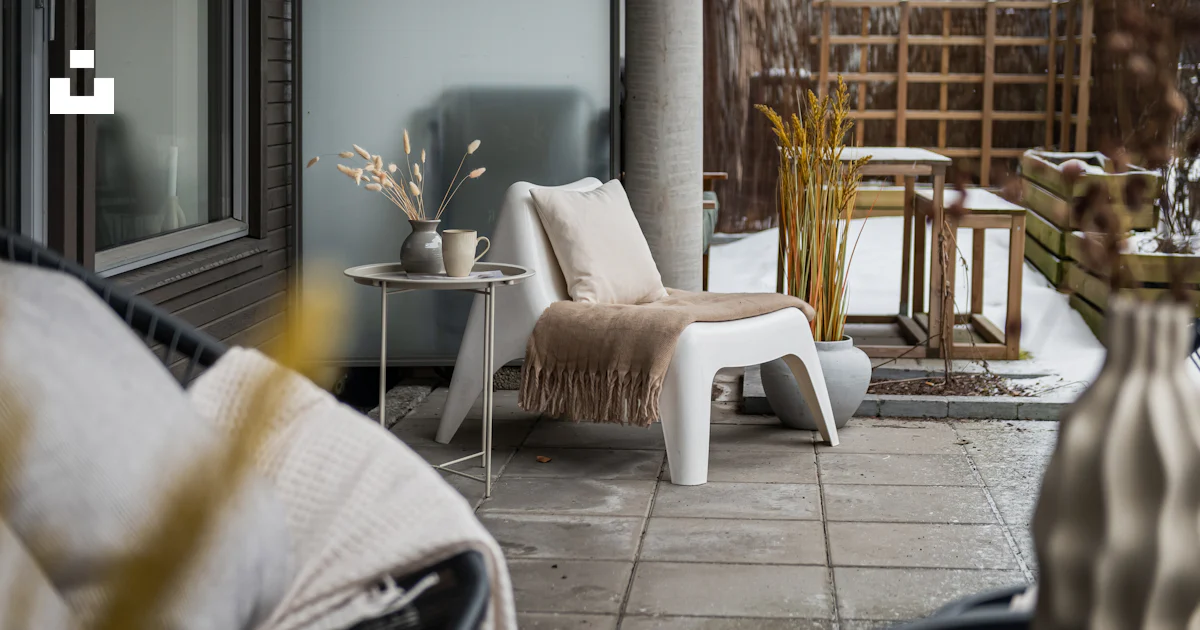 A balcony with a chair and a table photo – Free Interior design Image ...