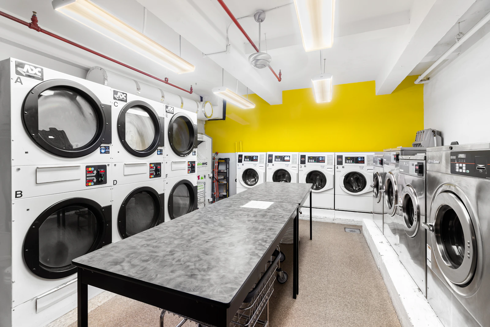 Bright utility room with a washer and tumble dryer placed side by side