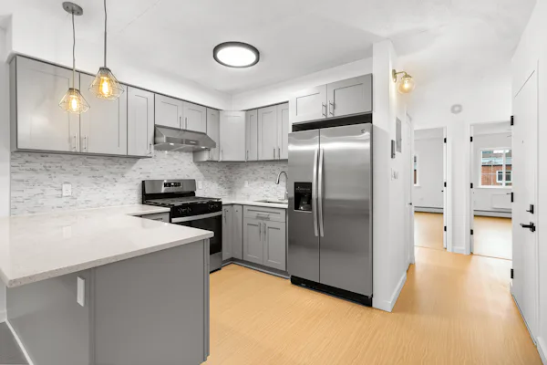 Modern San Francisco kitchen with a refrigerator, stove, and sink