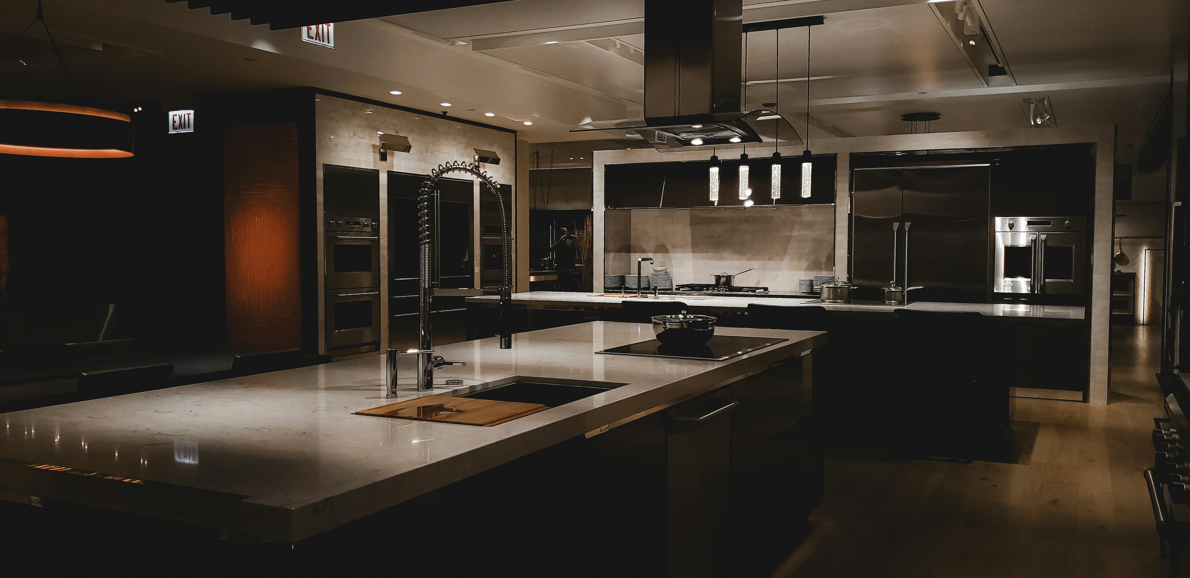 A large kitchen with a center island and stainless steel appliances