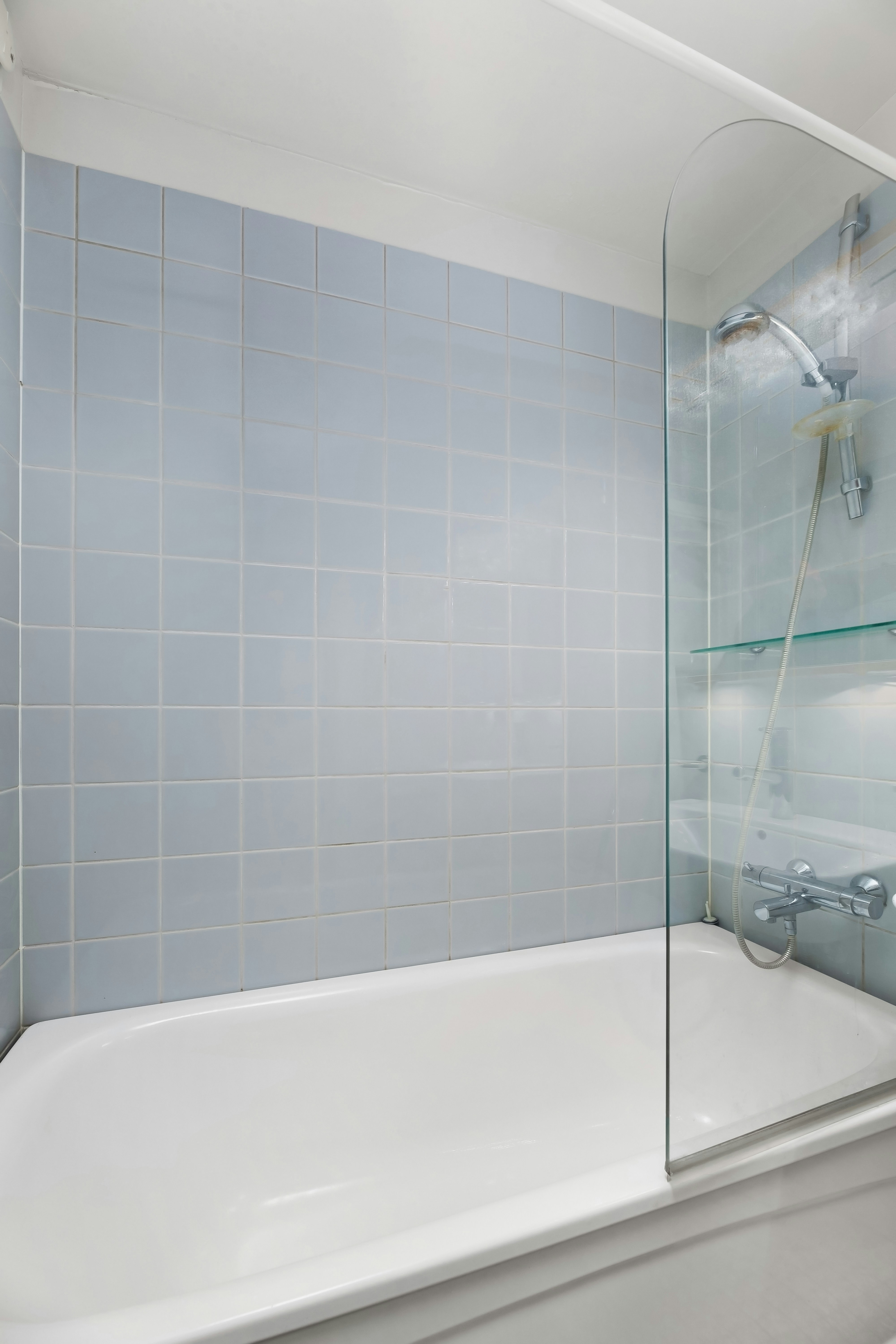 Modern walk-in shower with glass enclosure