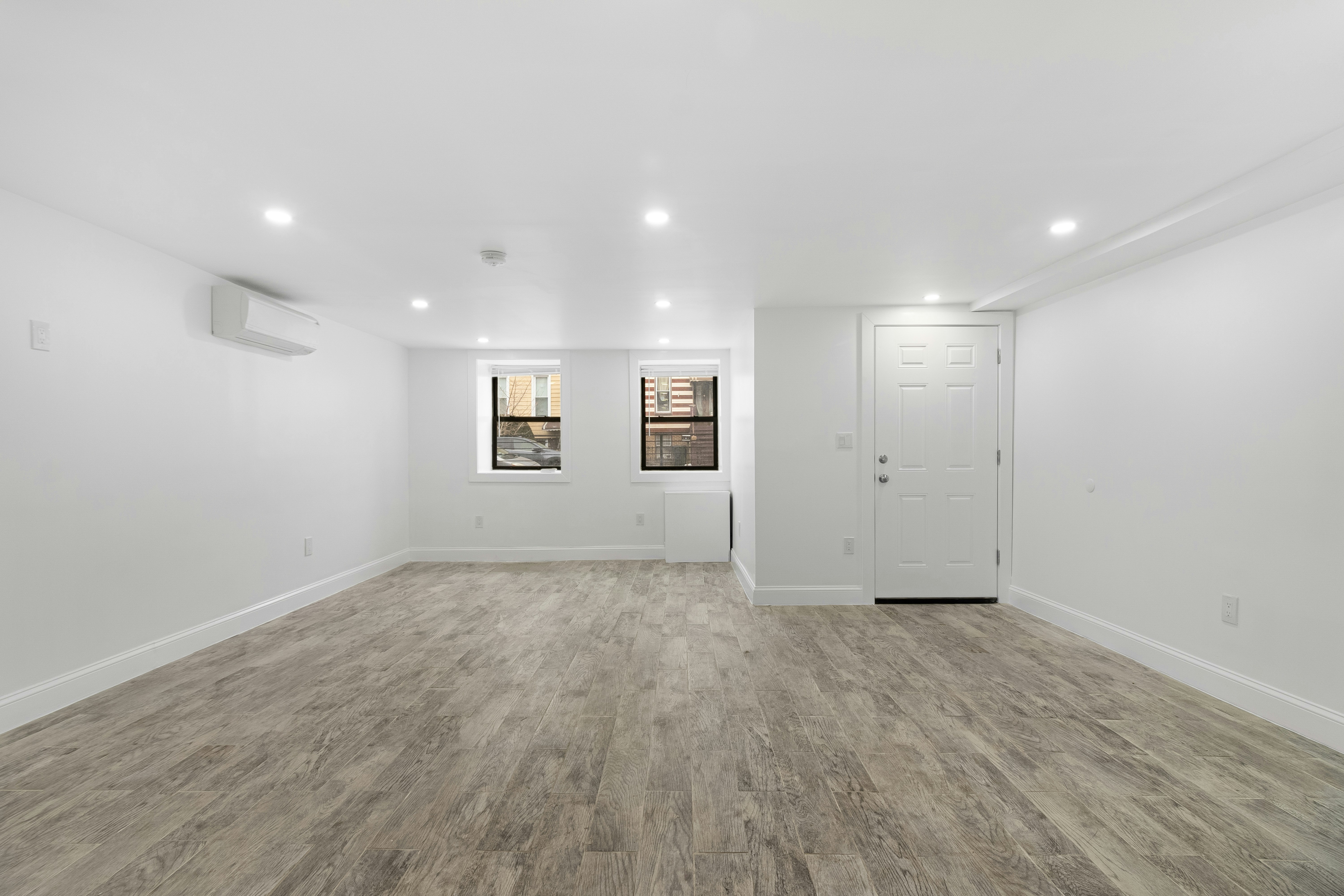 An empty, organized room with clean floors and walls, bathed in natural light, ready for professional cleaners to finalize the move-out cleaning. - best move-out cleaning in broomfield co