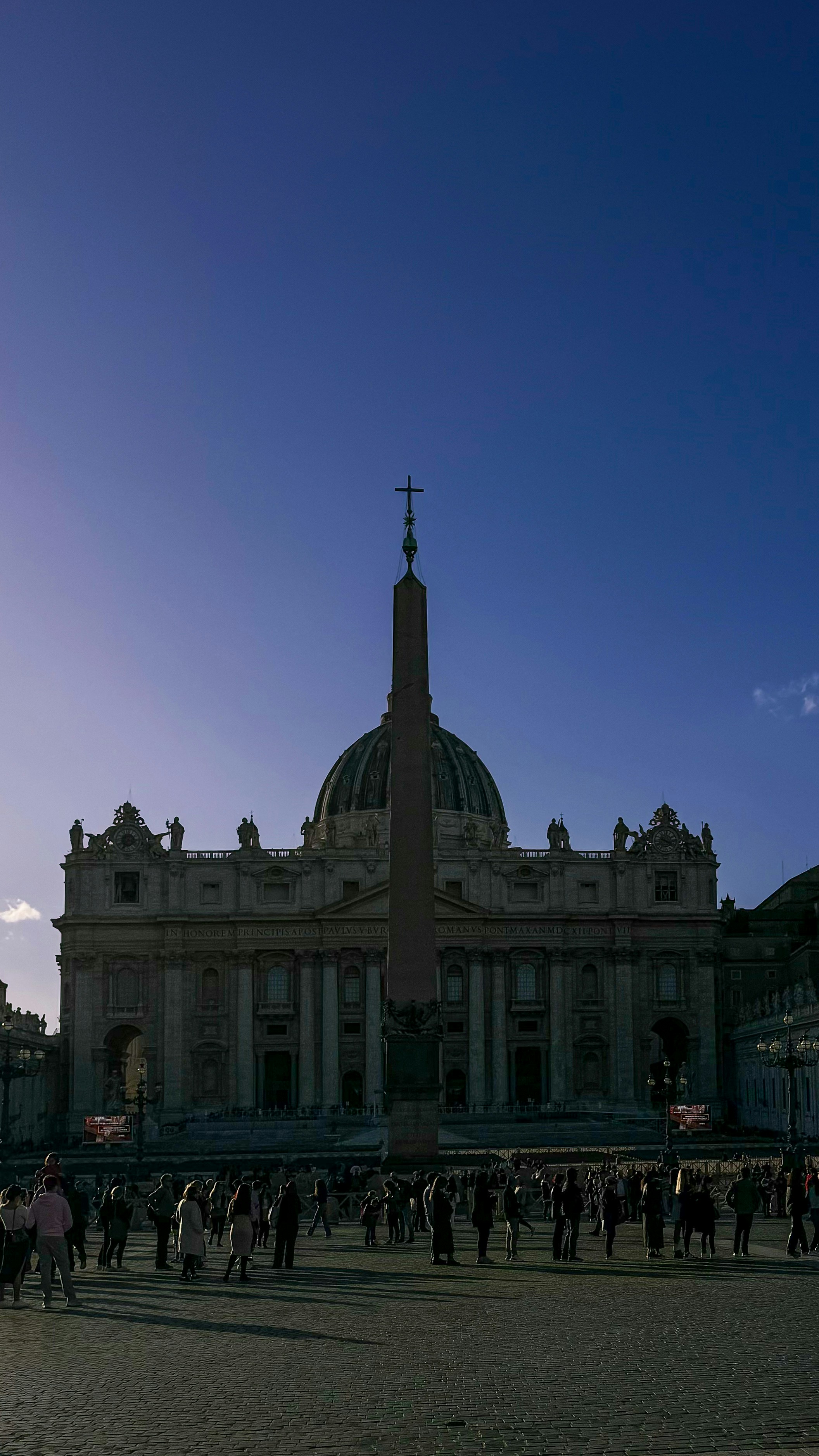 A group of people standing in front of a building