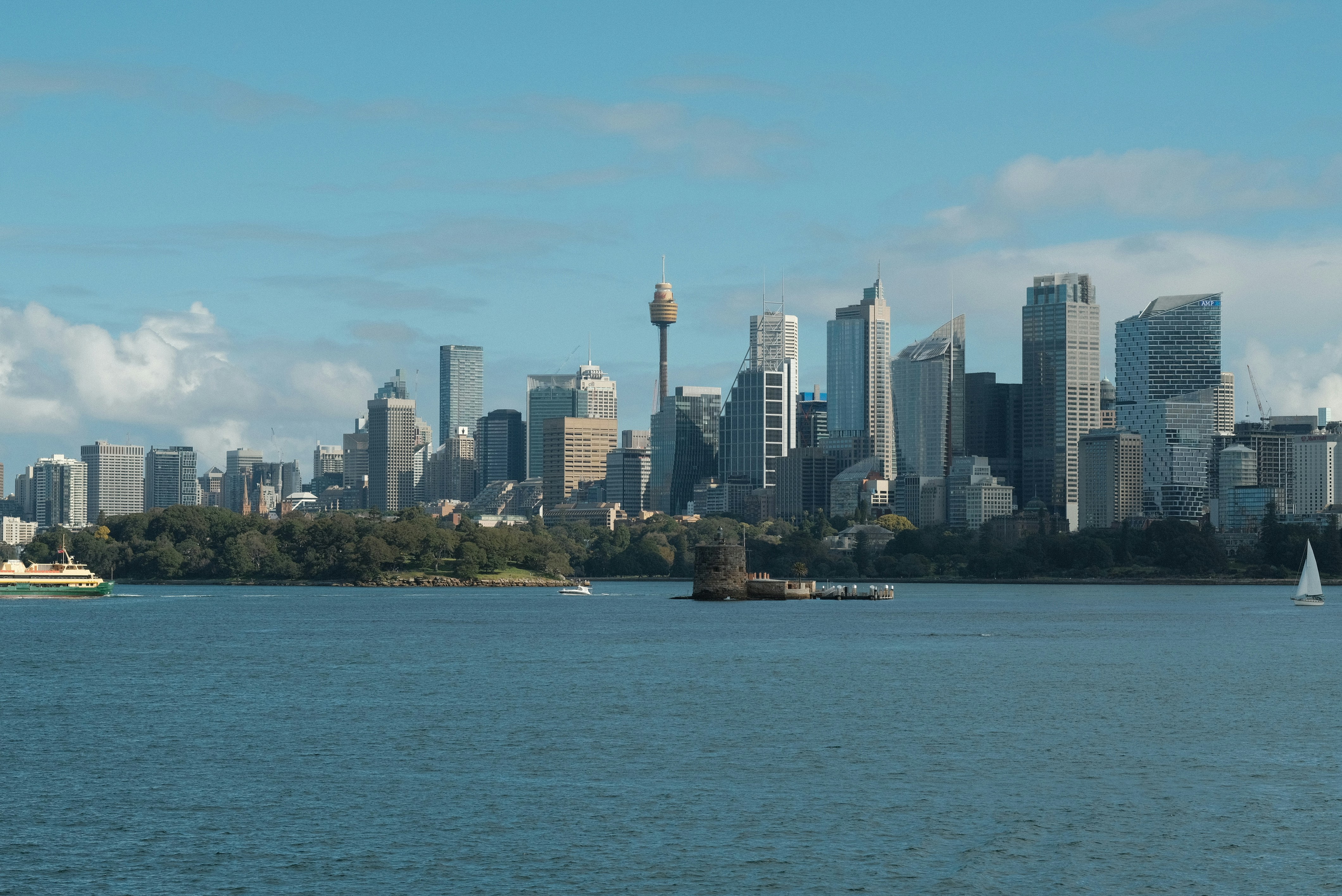 A large body of water with a city in the background