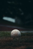 A white soccer ball sitting on top of a lush green field