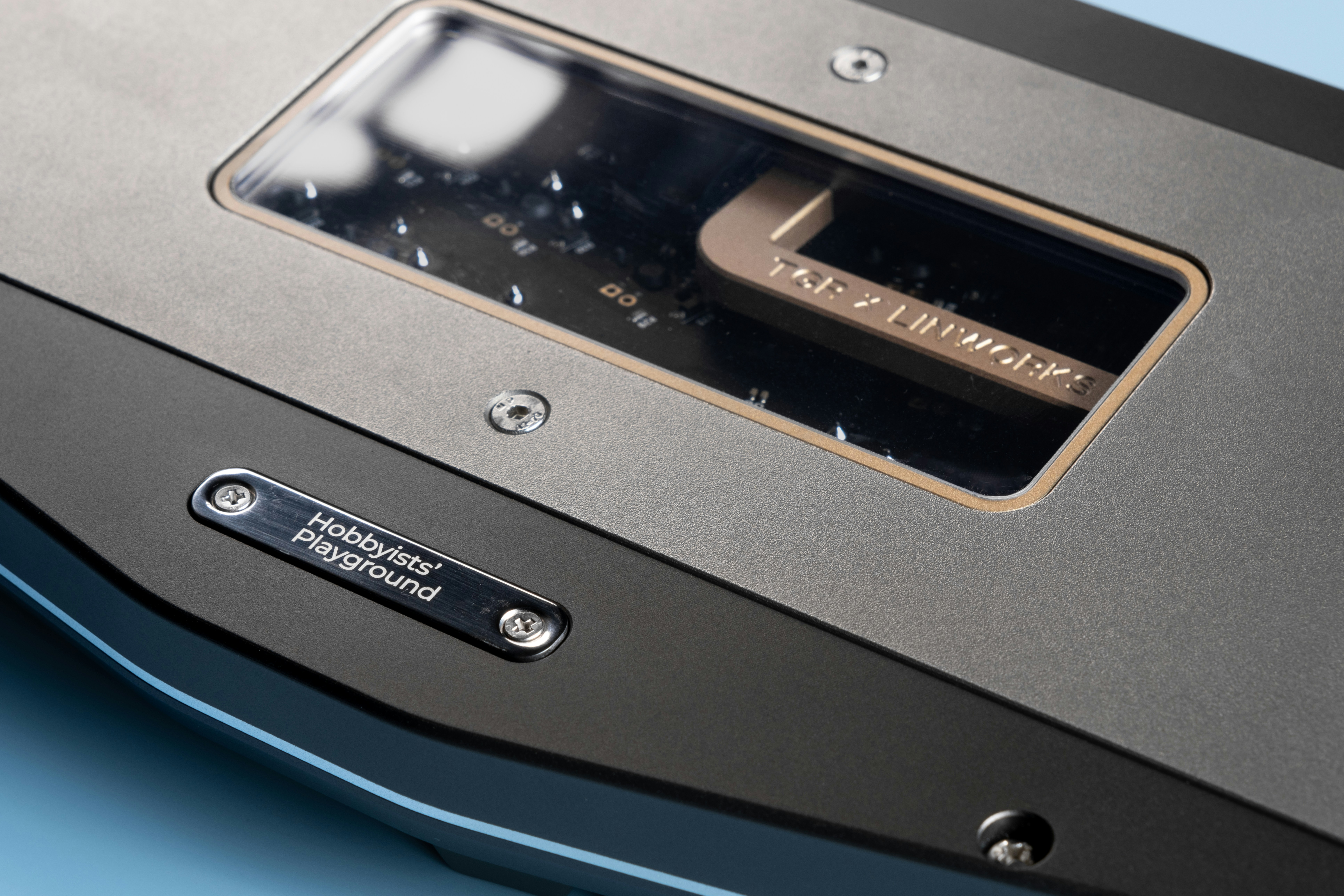 A close up of a metal object on a blue surface
