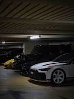 A group of cars parked in a parking garage