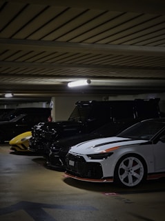 A group of cars parked in a parking garage
