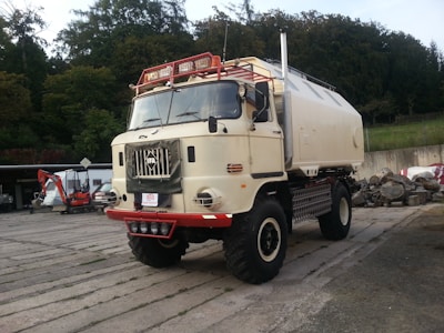 A large white truck parked in a parking lot
